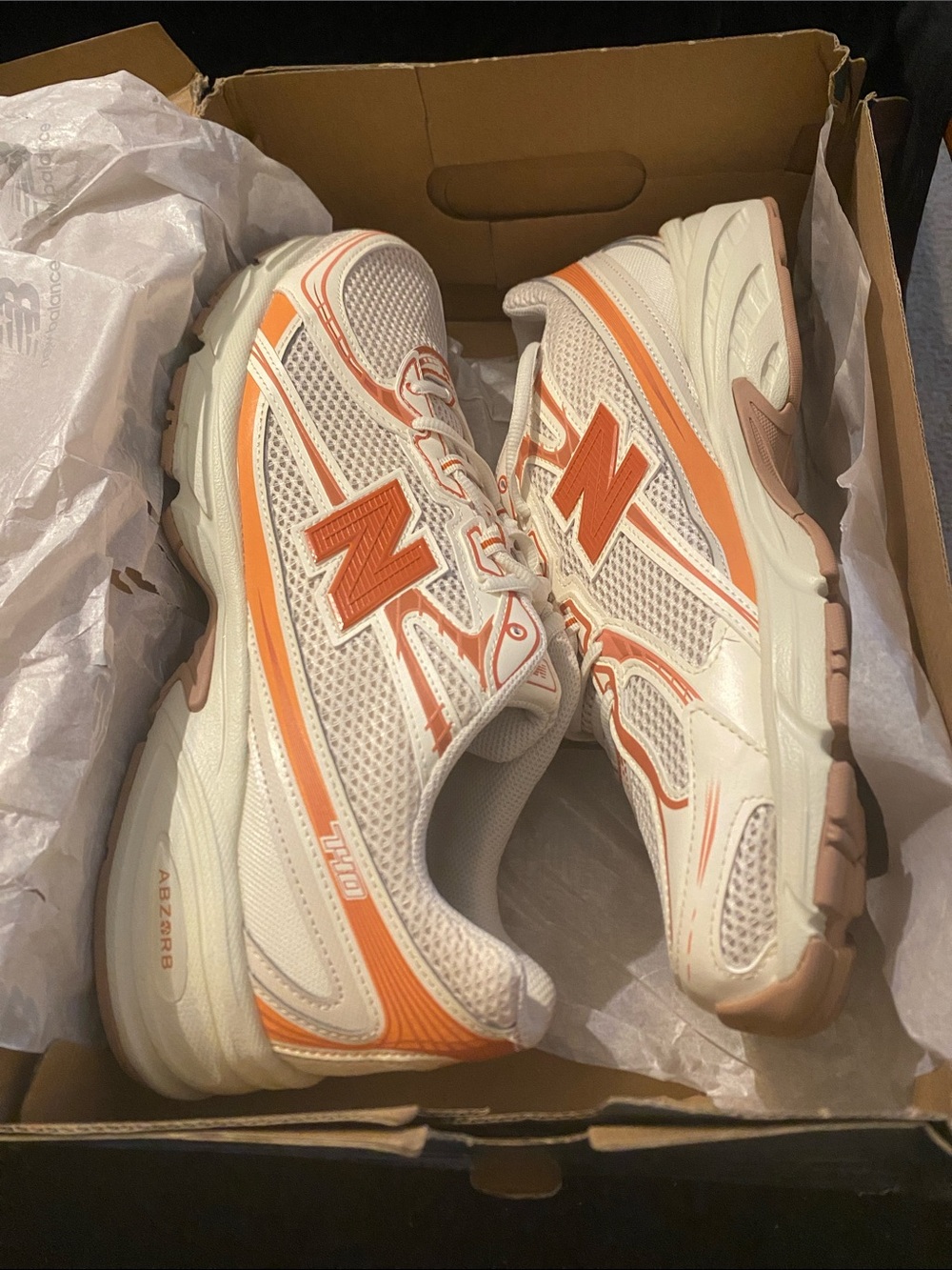 New Balance Women’s White and Orange Athletic Sneakers with Peach Accents